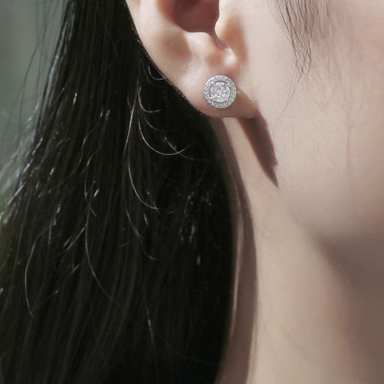 woman wearing eternal sparkle moissanite earrings